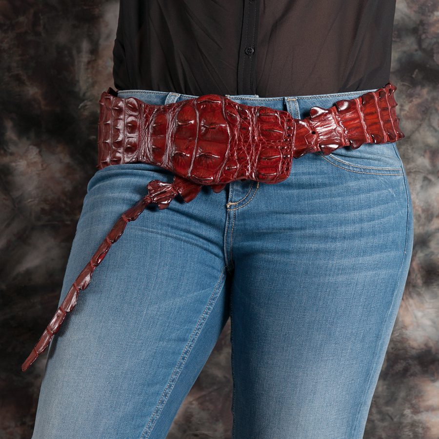 person with jeans and kulu crocodile fashion belt