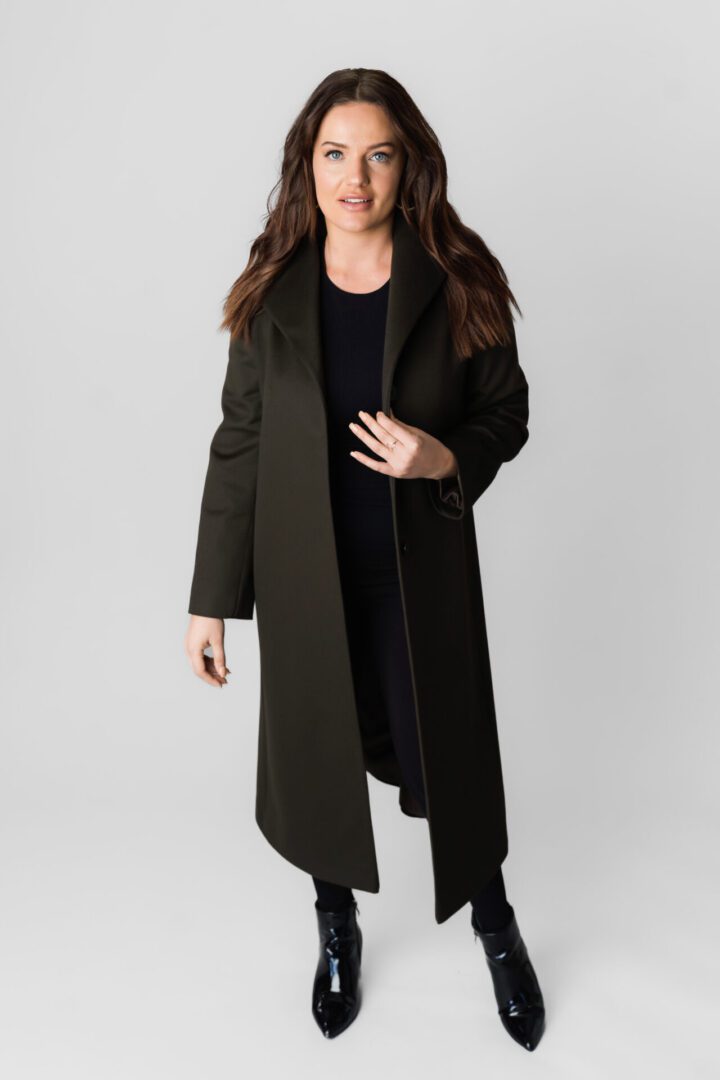 A Woman in a Mid Knee Length Brown Coat
