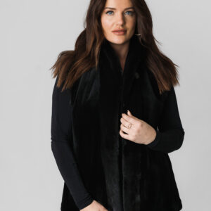 A Woman in a Black Color Short Coat