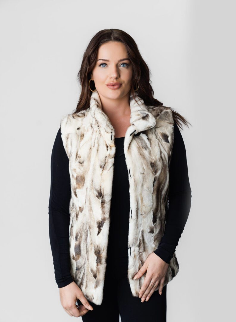 A White Color Fur Vest With Brown Strips