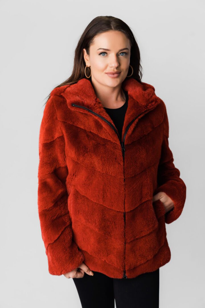 A Woman in a Red Color Fur Coat With Zipper