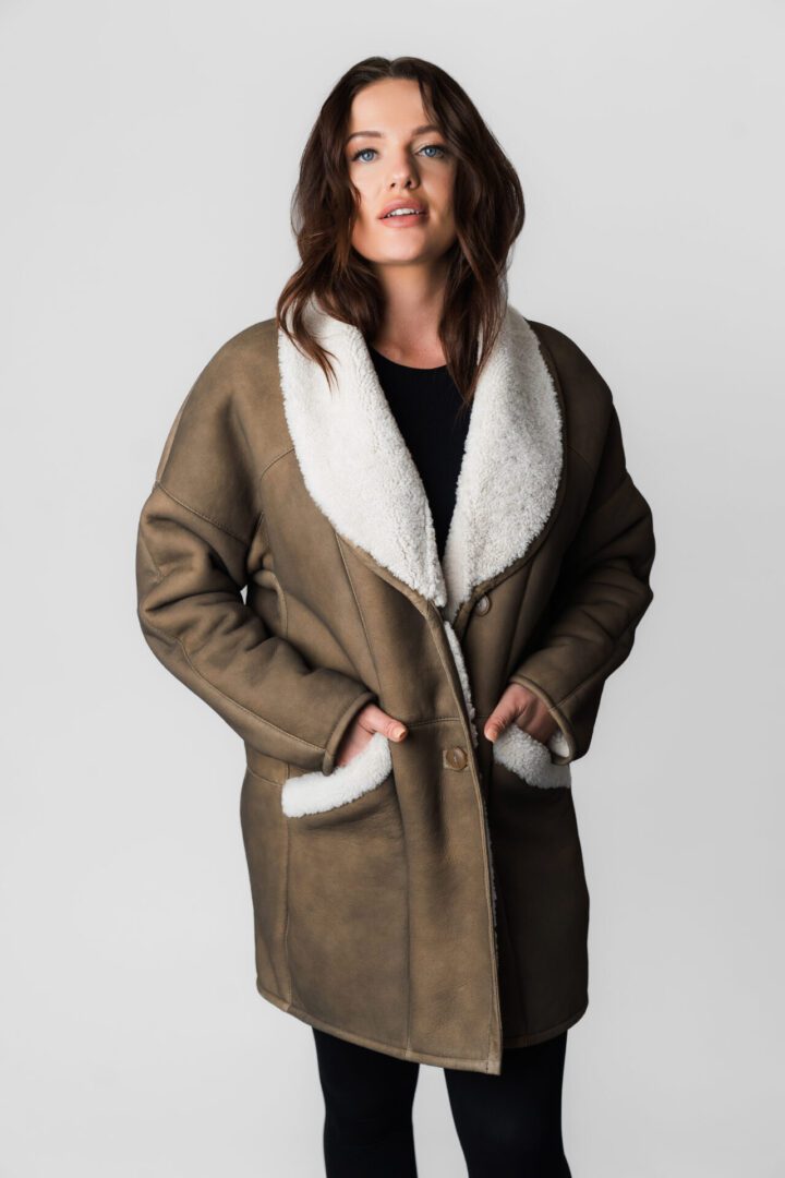 A Brown Color Jacket With White Fur Ending