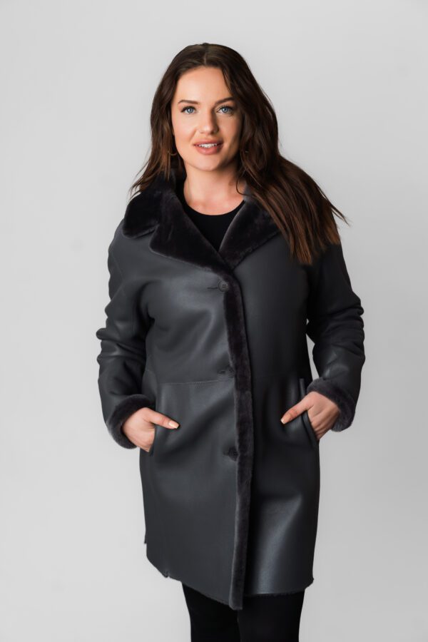 A Black Leather Coat With a Fur Strip