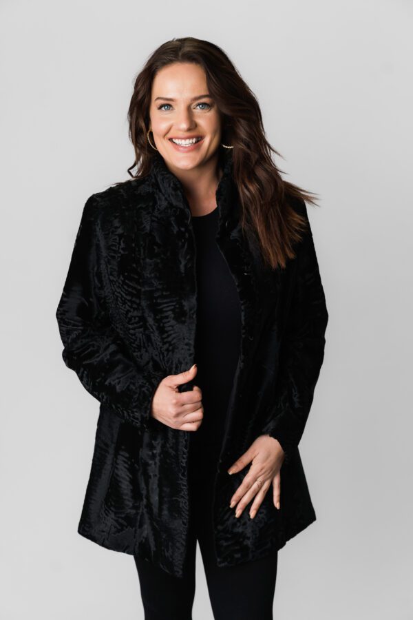 A Woman Wearing a Black Color Velvet Jacket