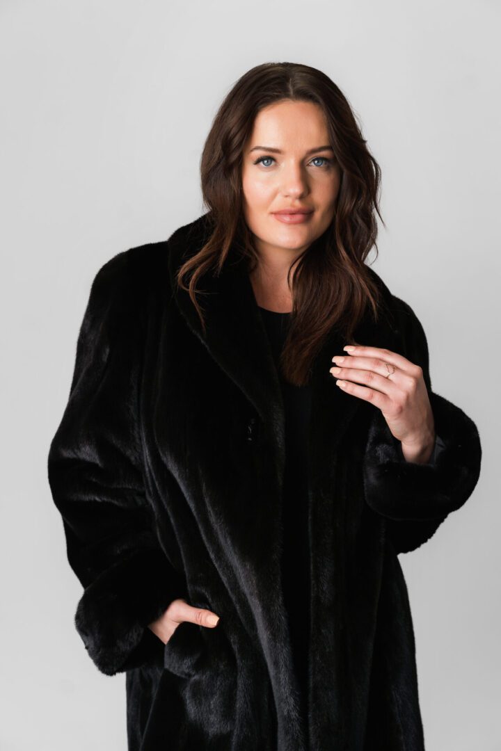 A Black Jacket With Velvet Texture and Pockets