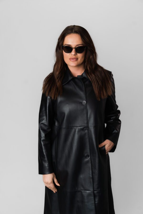 A Black Color Zip Down Leather Jacket With Button Closure