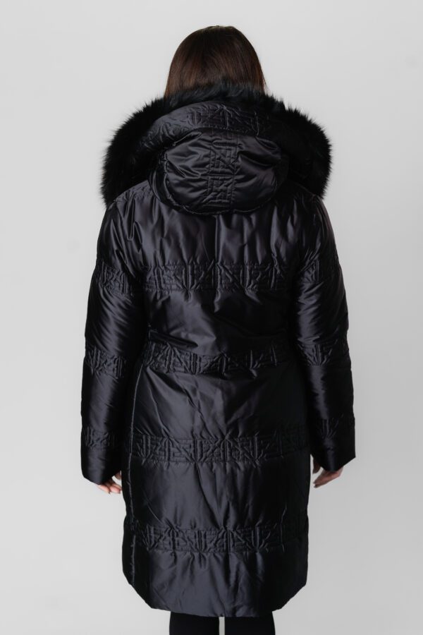 A Long Black Puffer Jacket With Fur Ends at Hood Back