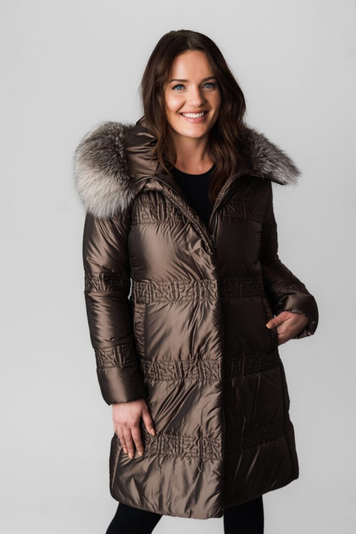 A Brown Color Puffer Jacket With Fur Ending